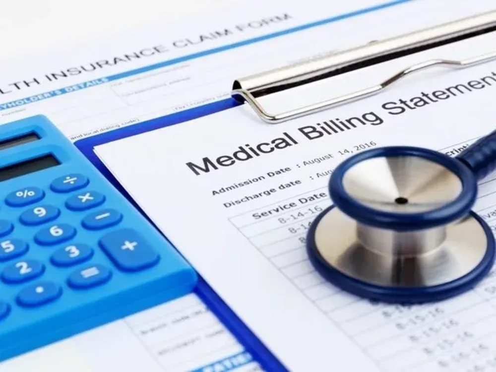 Stethoscope resting on a medical billing statement
